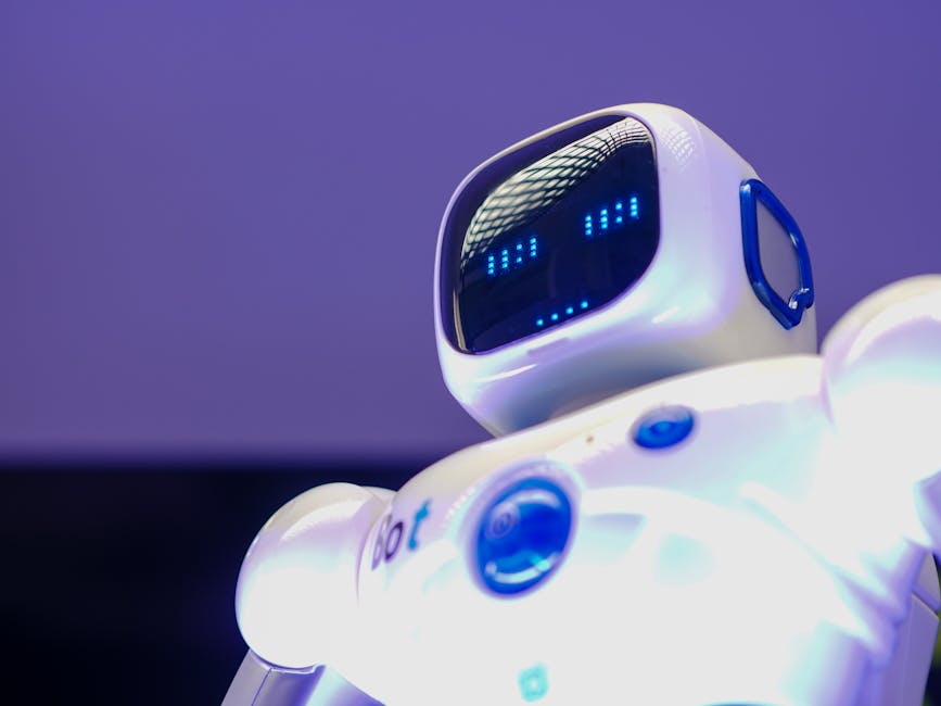 A modern humanoid robot with digital face and luminescent screen, symbolizing innovation in technology